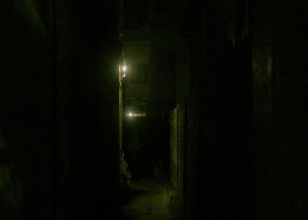 shadowy figure in dark alley